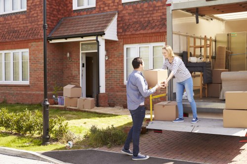 Professional flat removals team handling apartment furniture in Noakhill