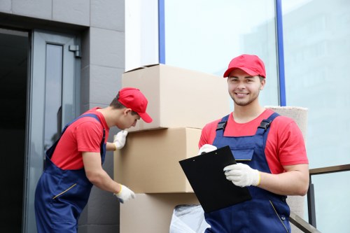 Storage staff reviewing safety procedures in an orderly warehouse area