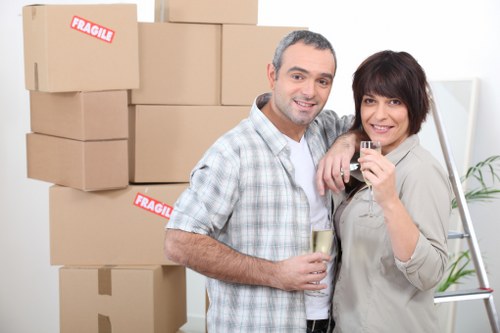 Local moving team handling furniture and packed boxes in Noakhill